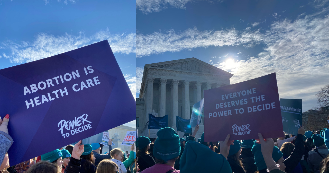 People holding Power to Decide's signs at the #MyRightMyDecision rally. 