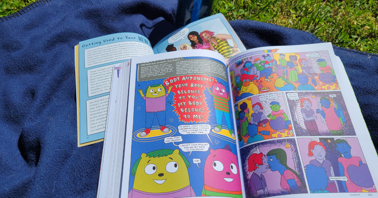 A photo of the two books reviewed in the blog, sitting open on a blanket in the grass.
