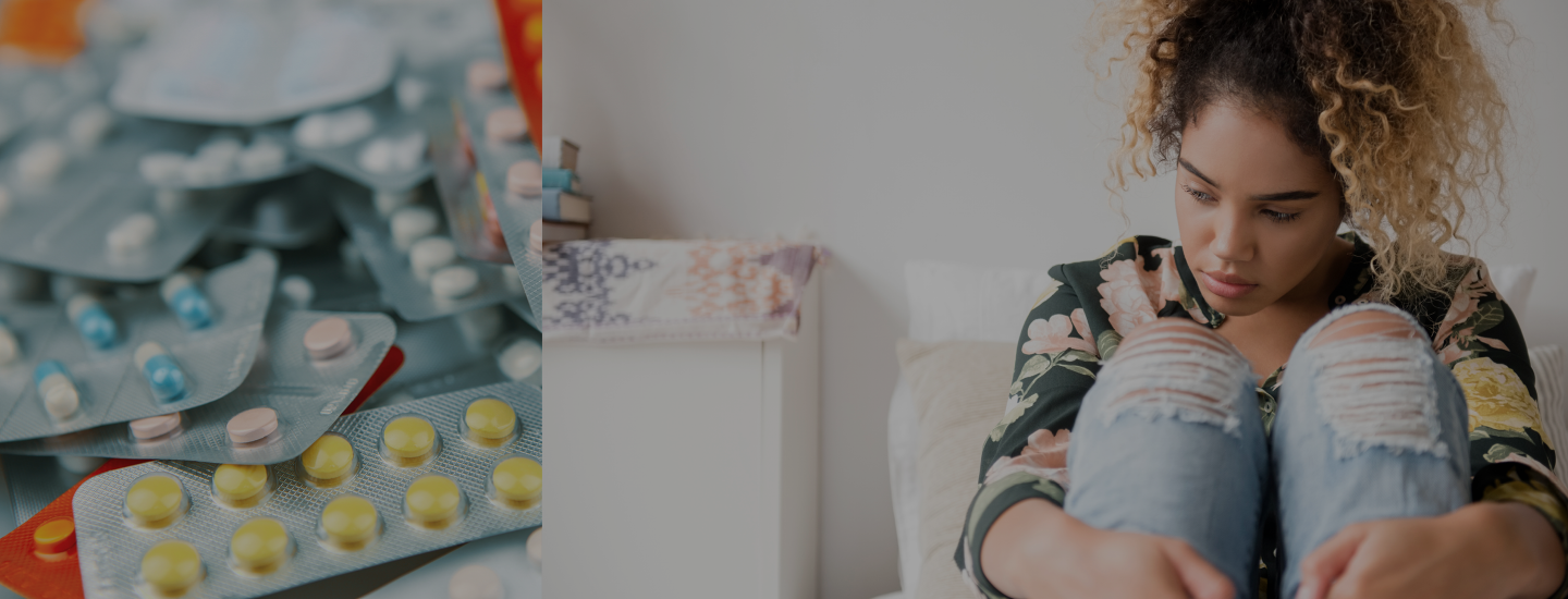 A pile of birth control pills and a woman sitting against a wall looking stressed