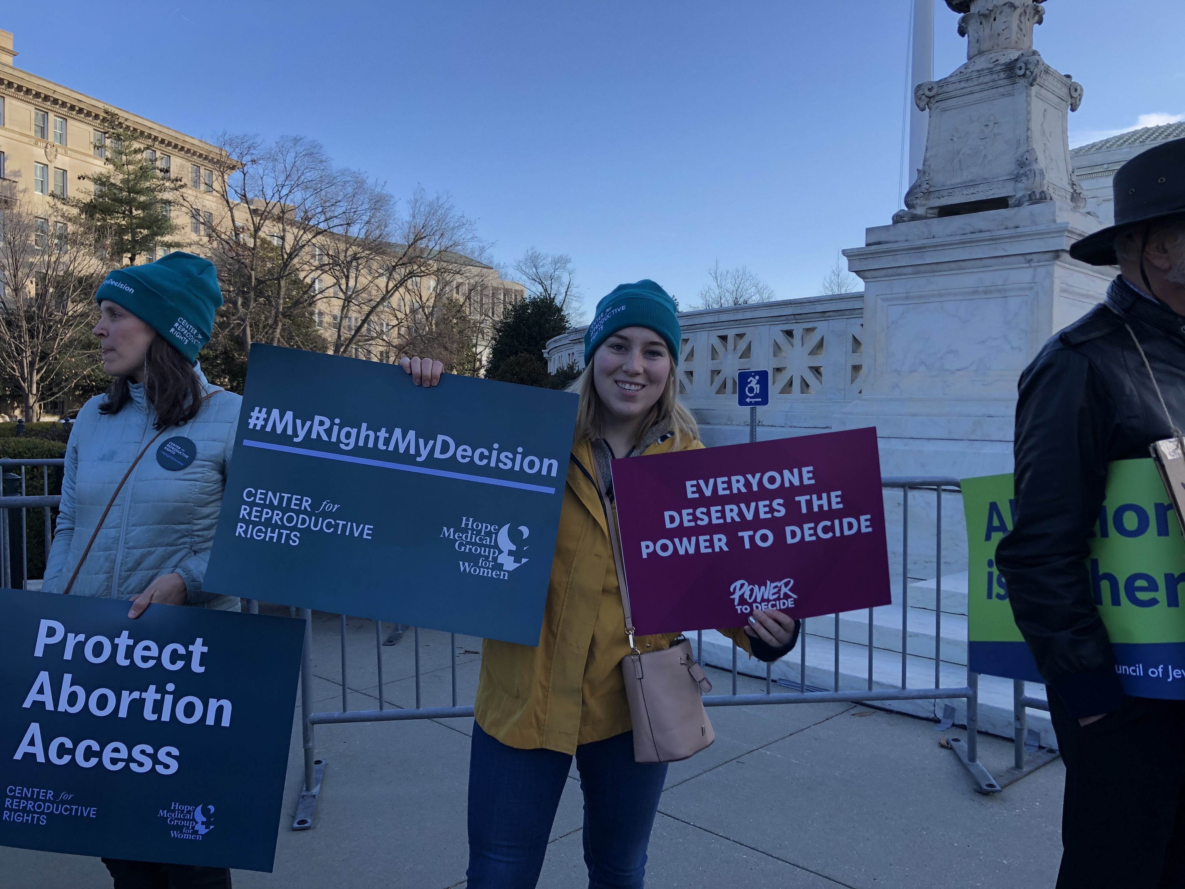 A person holds up a Power to Decide sign at the #MyRightMyDecision rally.